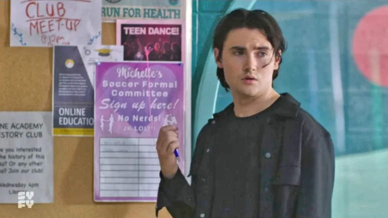 Spencer Macpherson as Sparrow, the broody, James Dean-like dude Astrid has a crush on, shown here signing up for Michelle’s Soccer Formal committee. - Astrid and Lilly Save the World 101