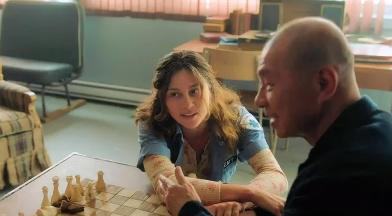 Chloe Van Landschoot as Kristi, a third-year med student who is now the town's doctor, and Simon Sinn as Deputy Kenny's father Bing-Qian Liu - From