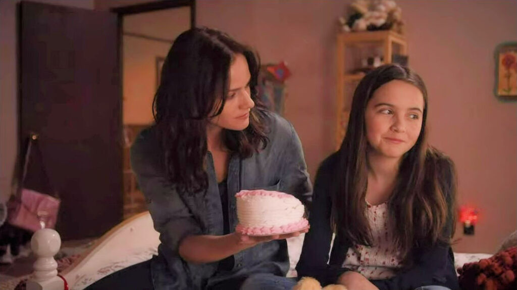 Kelly Overton as Vanessa and Hannah Cheramy as Dylan with birthday cake - Van Helsing 102