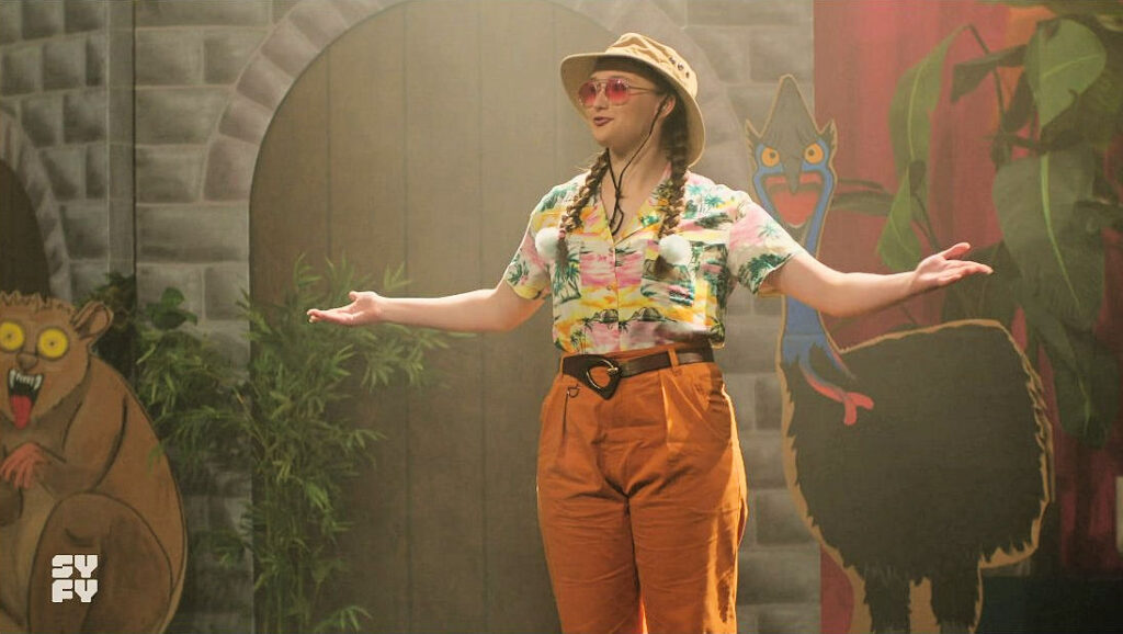 Emma Troake as a 'Down Under' version of the Chorus in a school play - Astrid and Lilly Save the World 109