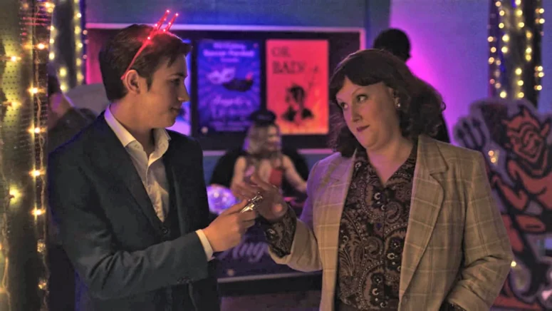 Bradley (Noah Perchard) has his flask confiscated by one of the chaperones (Co-showrunner Betsy Van Stone) - Astrid and Lilly Save the World 110