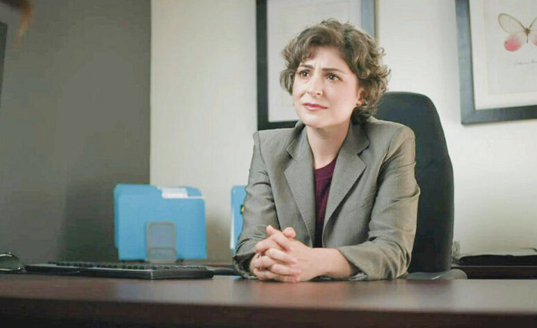 Elena Dunkelman as the mining company's HR officer - All My Husband's Wives