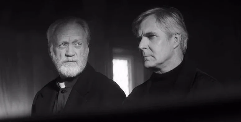 Father Graham (Nigel Bennett) eyes his predecessor Frederick (Henry Czerny) warily while dispensing priestly advice - The Righteous