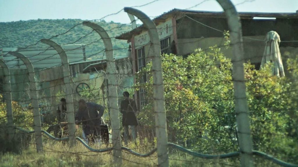 Native Li Tolqans behind barbed wire - Infinity Pool