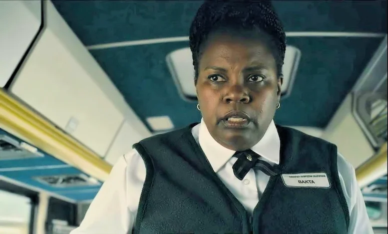 Angela Moore as the bus driver Bakta - From 202