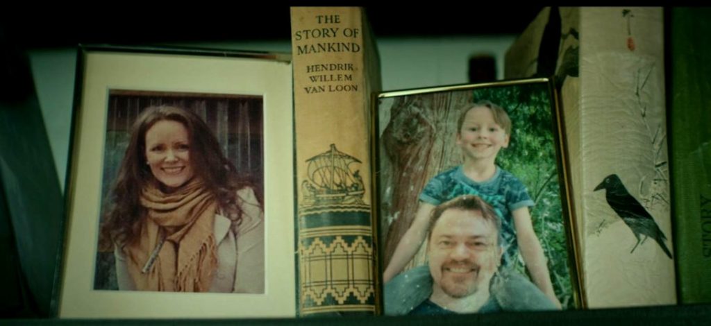 photos on James' shelf - his mother and step father