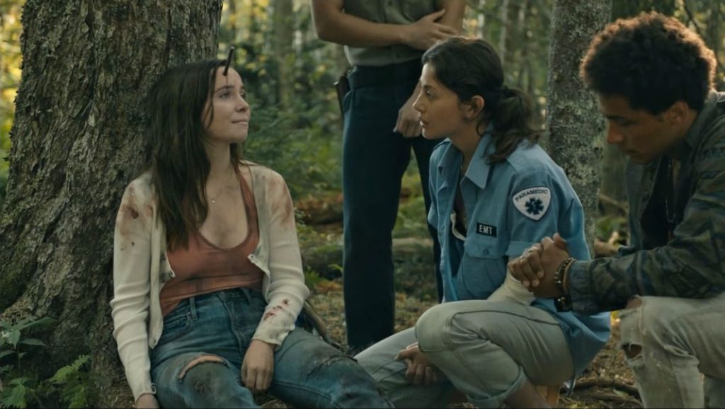 Kristi (Chloe Van Landschoot) comforts the fatally-injured Kelly (Phoebe Rex). - From 203