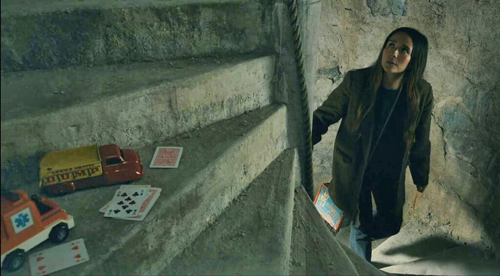 Catalina Sandino Moreno as Tabitha ascending the stairs in the lighthouse - From