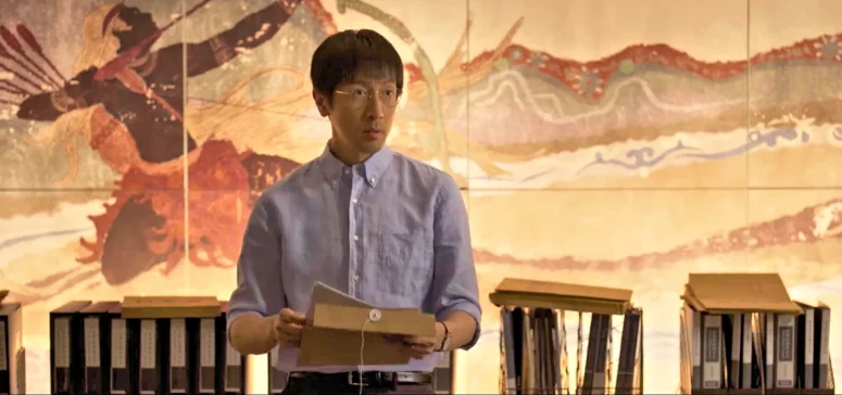 Wang Miao standing (possibly symbolically) in front of a mural depicting Houyi, shooting down the suns. - Three Body