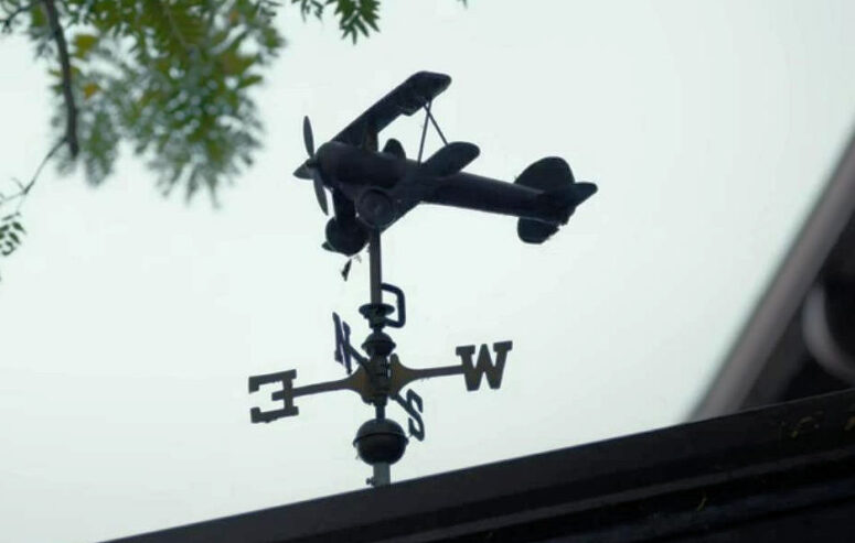 The squeaky biplane weather vane on Jules' old house