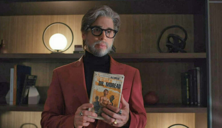 Felix (Jordan Gavaris) holds Kira's copy of The Island of Dr. Moreau - Orphan Black: Echoes 102