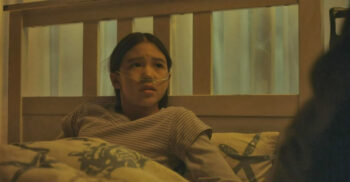 Milan Deng as Zora. - Deng and Marnie McPhail (Dr. Teller) are also in the cast of M. Night Shyamalan's psychological thriller TRAP.