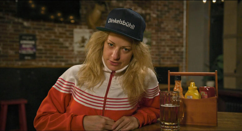 Karen Knox as Boris - Slo Pitch