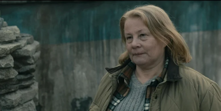 Donna (Elizabeth Saunders) builds a cairn in front of the spot where Dale died. - From 306