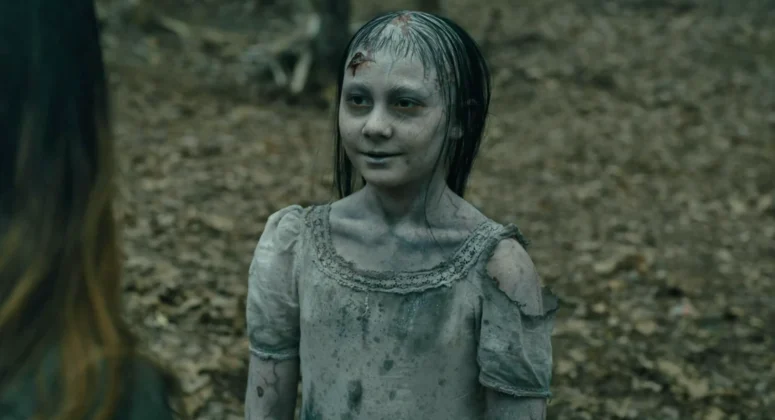 One of the 'ghoulish children' (Isobel Del Degan) speaks to Tabitha.