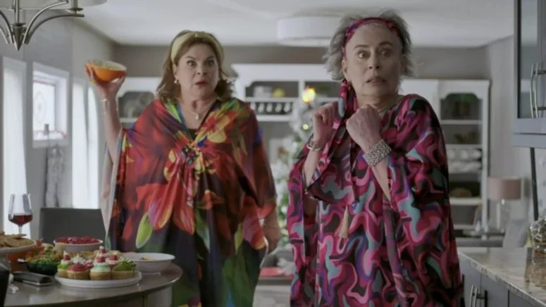 The food fight between Millie (Linda Kash) and Nell (Mimi Kuzyk) is interrupted.