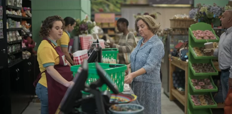 Lucille (Loren Loubser) and Tannie Elna (Martelize Kolver) gossip at Dorrette's Deli - Recipes for Love and Murder