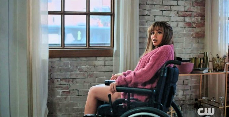 Max (Vanessa Morgan) in a wheelchair by her window - Wild Cards 204