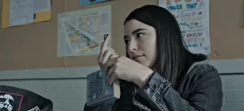 Leah (Nicole Munoz) with Dostoevsky's Crime and Punishment