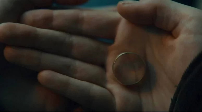 The ring Em is holding at her planned rendezvous with the professor