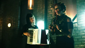 Unnamed folk singer (Emma Pederson) and her uncredited accompanist at The Royale - Killjoys 101