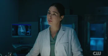 Manuela Sosa as Coroner Olive - Wild Cards 303