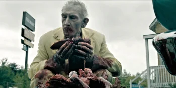 The Man in Yellow (Douglas E Hughes) eating a freshly harvested organ from a corpse circa 1979 - From 404