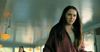 Julie (Hannah Cheramy) is angered by the suggestion that her arrival in the town might have been the cause of recent misfortune - From 403