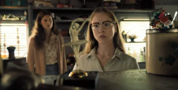 With Sarah (Avery Konrad) in the background, Sophia (Julia Doyle) seems fascinated by a ballerina figurine - From 402