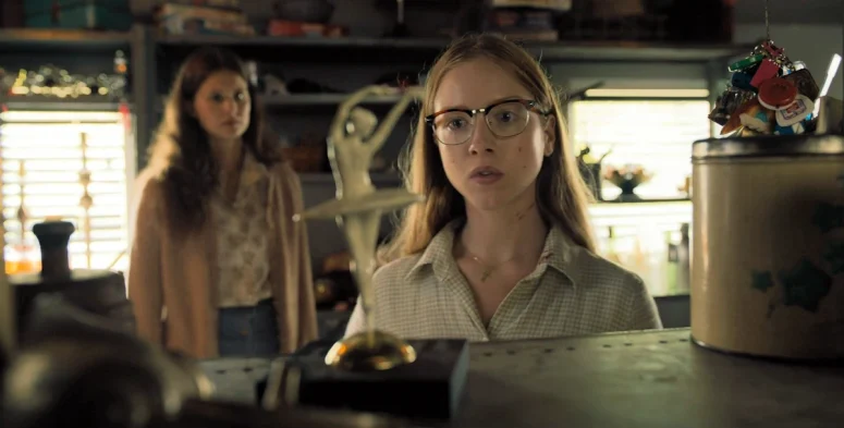 With Sarah (Avery Konrad) in the background, Sophia (Julia Doyle) seems fasciated by a ballerina figurine - From 402