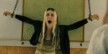 Mari (Kaelen Ohm) has her hallucination of being shackled return in the clinic after Sophia touches her arm - From 405