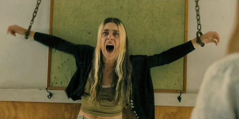 Mari (Kaelen Ohm) has her hallucination of being shackled return in the clinic after Sophia touches her arm - From 405