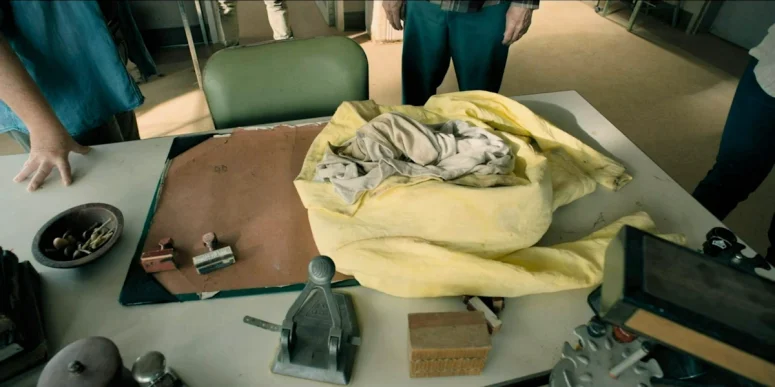 The discarded yellow suit on Boyd's desk - From 404