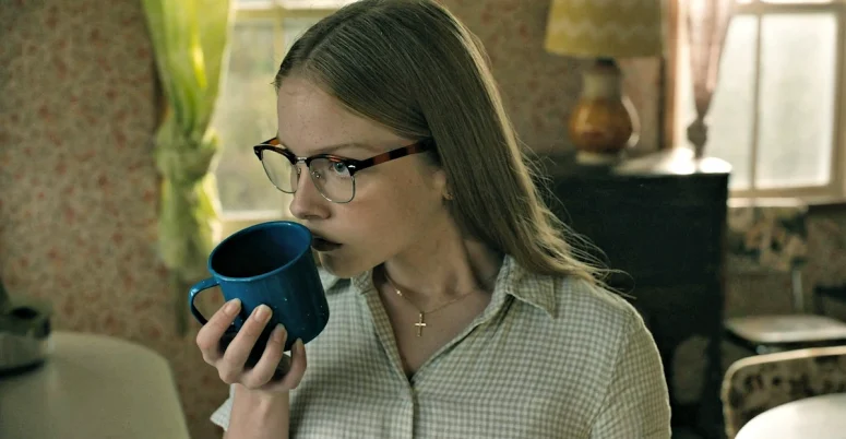 Sophia (Julia Doyle) sniffs a cup in Tabitha's kitchen - From 408