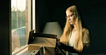 Sophia (Julia Doyle) finds the yellow suit in a box in Boyd's bedroom - From 408