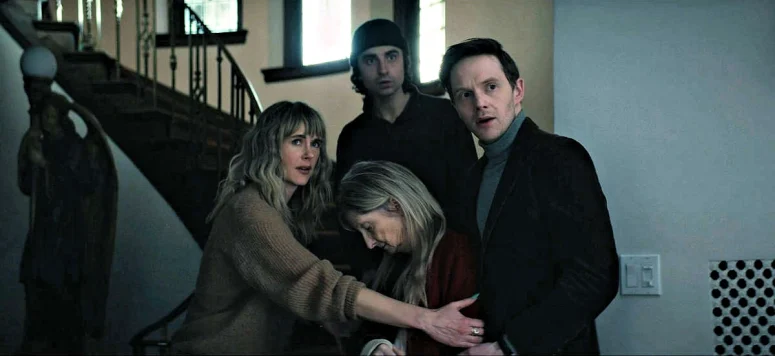 Harriet (Sheila McCarthy) faints into the arms of three of her children when the fourth one, Annika, arrives. - The Voices of Our Mother