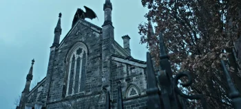Father Roslovic's church, with a gargoyle on top that perhaps only certain people can see. - The Voices of Our Mother