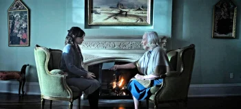Johanna (Sarah Ferguson) gives Annika (Georgina Reilly) a handwritten prayer to say for Harriet. - The Voices of Our Mother