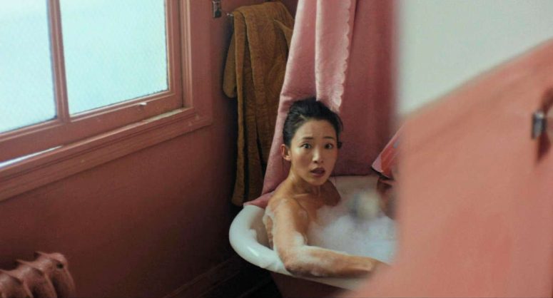 Christin Park as Leslie having a bath in an earlier version of the tub at Malcolm's cabin - Keeper