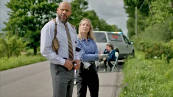 Maurice Dean Wint as Detective Troy Harper and Rachel MacMillan as Kara - 'Crossover Immortal Sins'